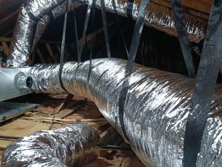 Newly installed ductwork in an attic.