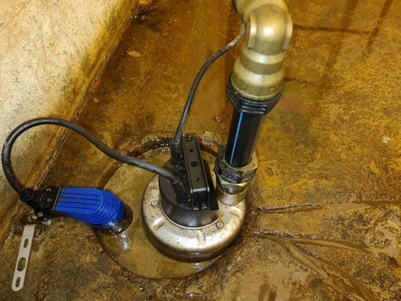 Newly installed ejector pump in basement.