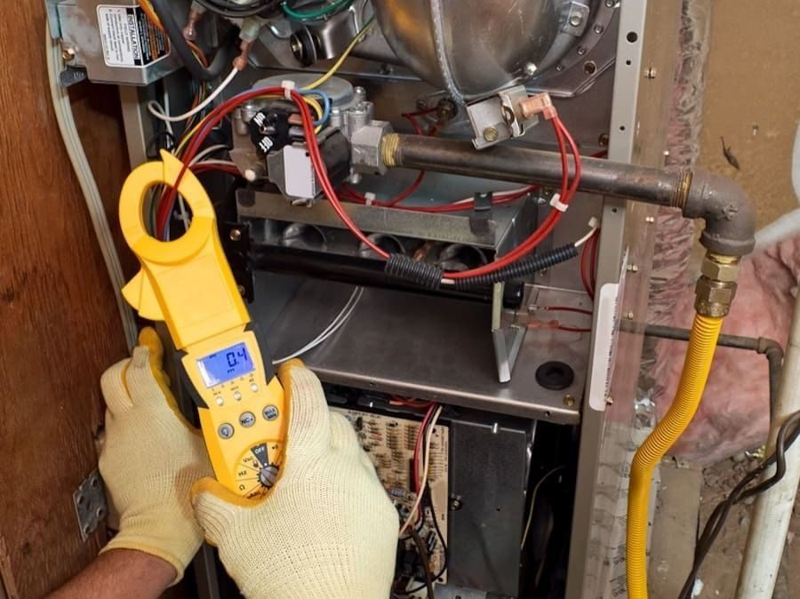 Professional working on a furnace repair