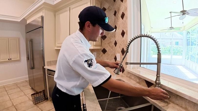 Stuart professional testing new kitchen sink fixture.