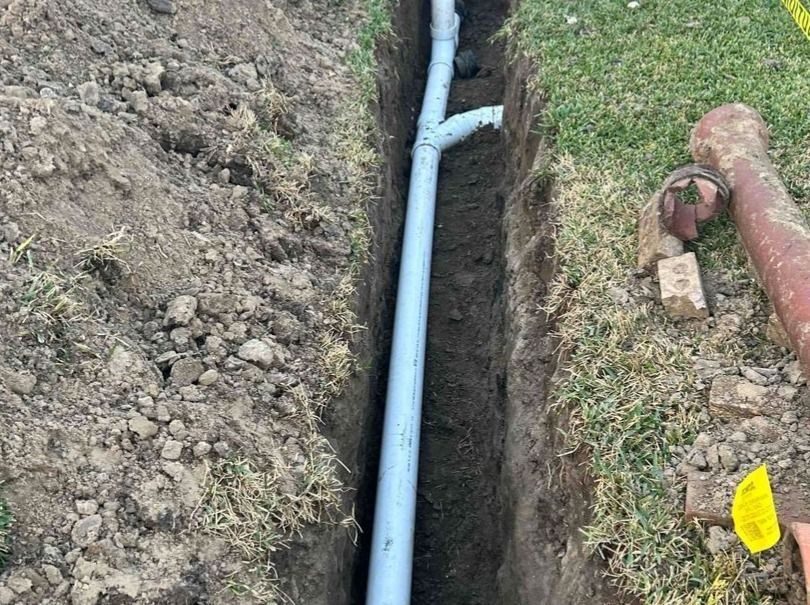 Open sewer line being repaired.