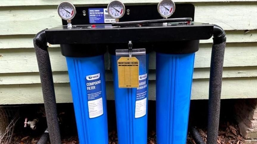 Water filtration installed outside home.